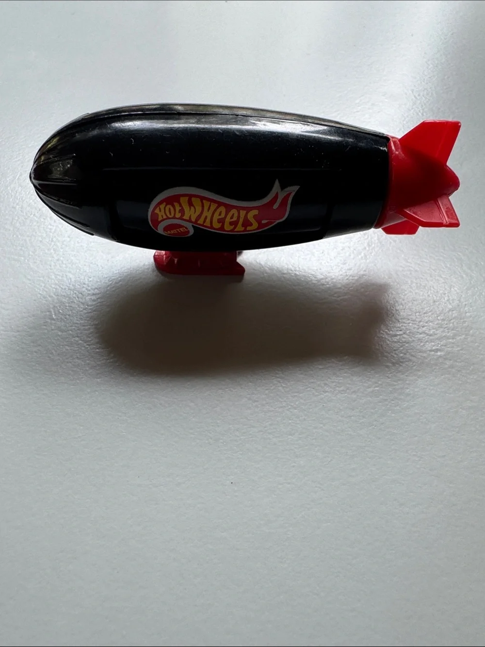 Black & Red Blimp Toy - Leading The Way